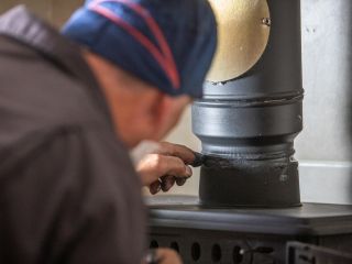 Professional chimney sweep ensuring a clean and safe fireplace in San Jose.